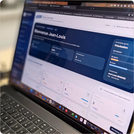 Close-up of a laptop screen showing a dashboard interface with user data and task prioritization.