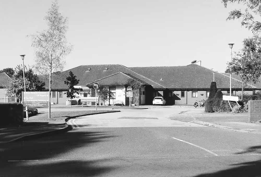 A black and white photo of Coalville Community Hospital.