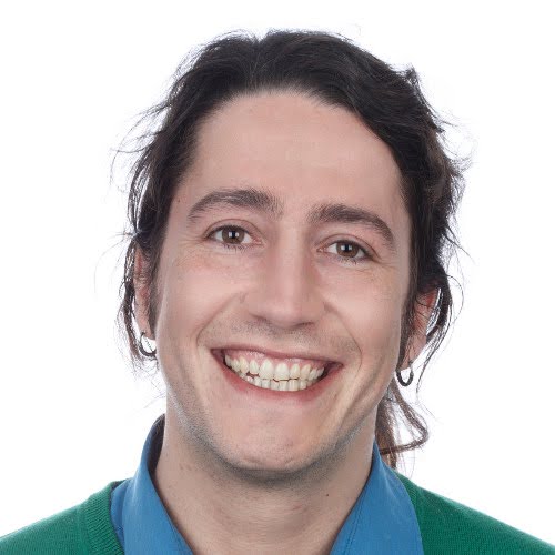 a man smiling for a picture