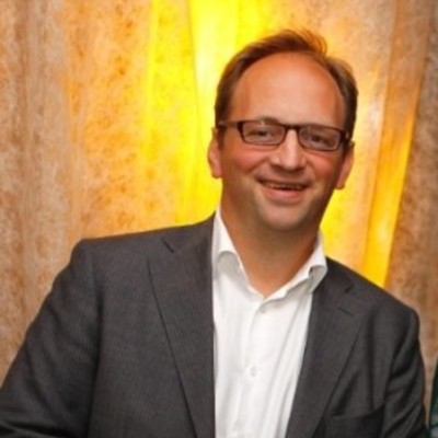 a man in a suit and glasses