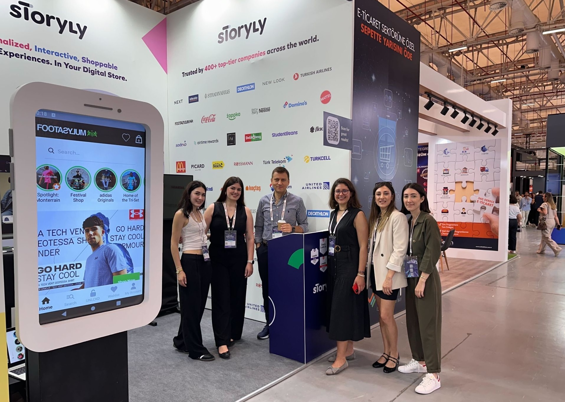 Image from an international physical event attended by Storyly's co-founder Soner Şensoy and other Storyly team members.