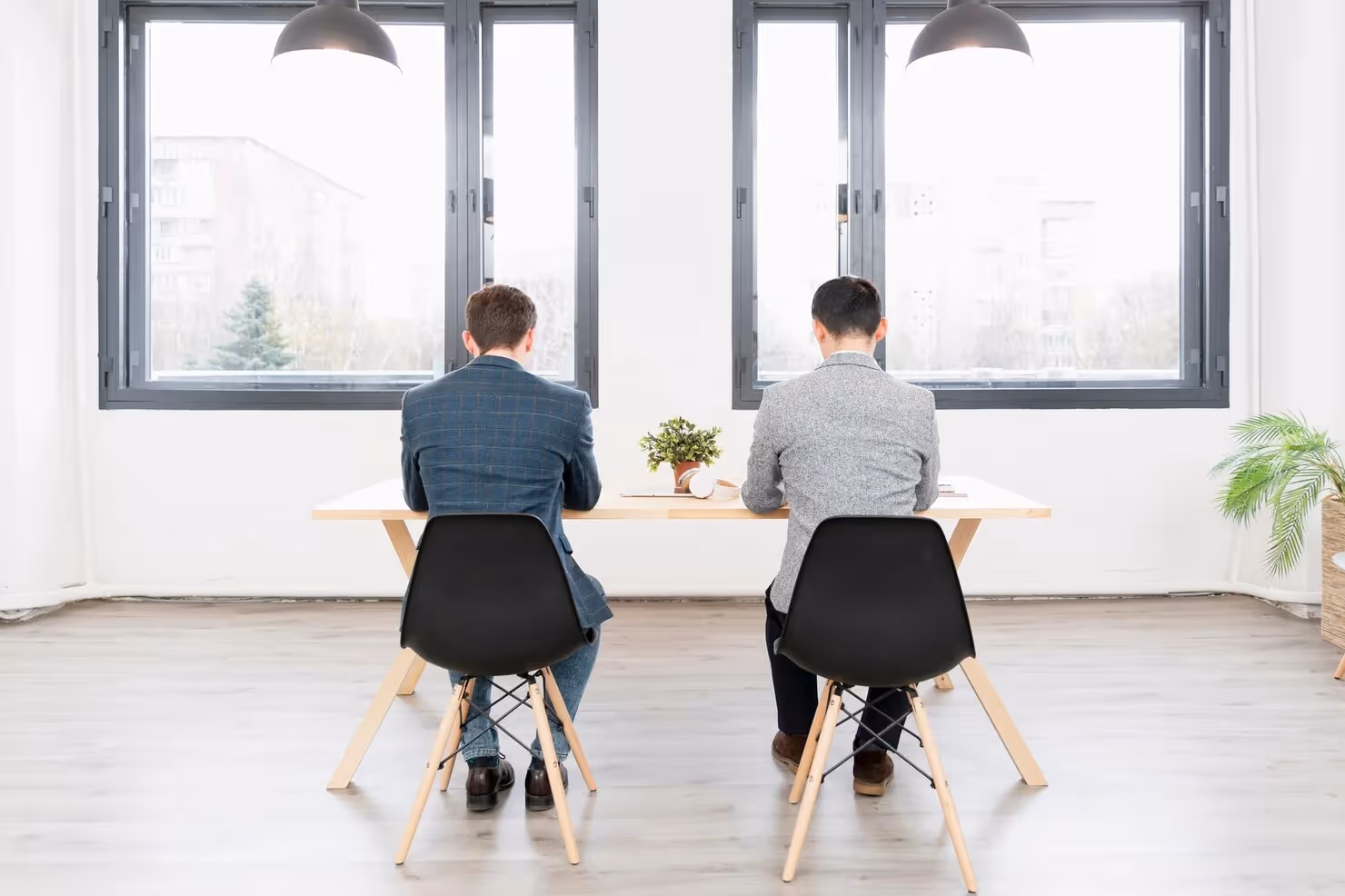 Two employee sitting next to each other