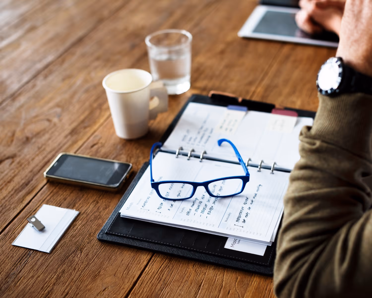 A business owner using a checklist to outsource successfully