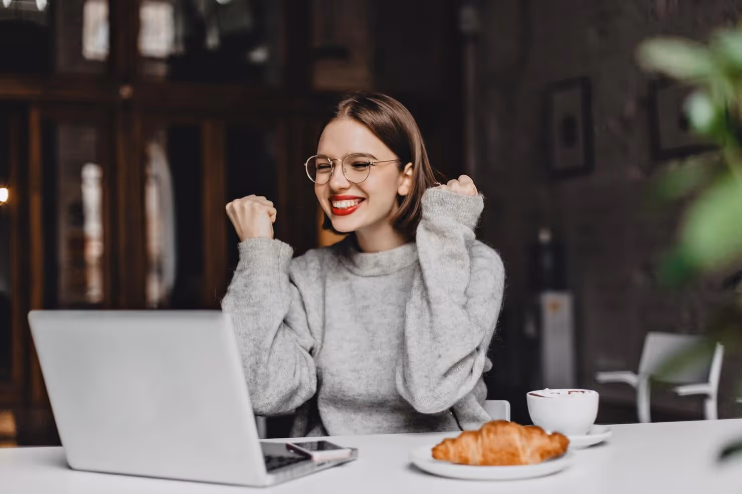 IT talent happy while looking at her computer