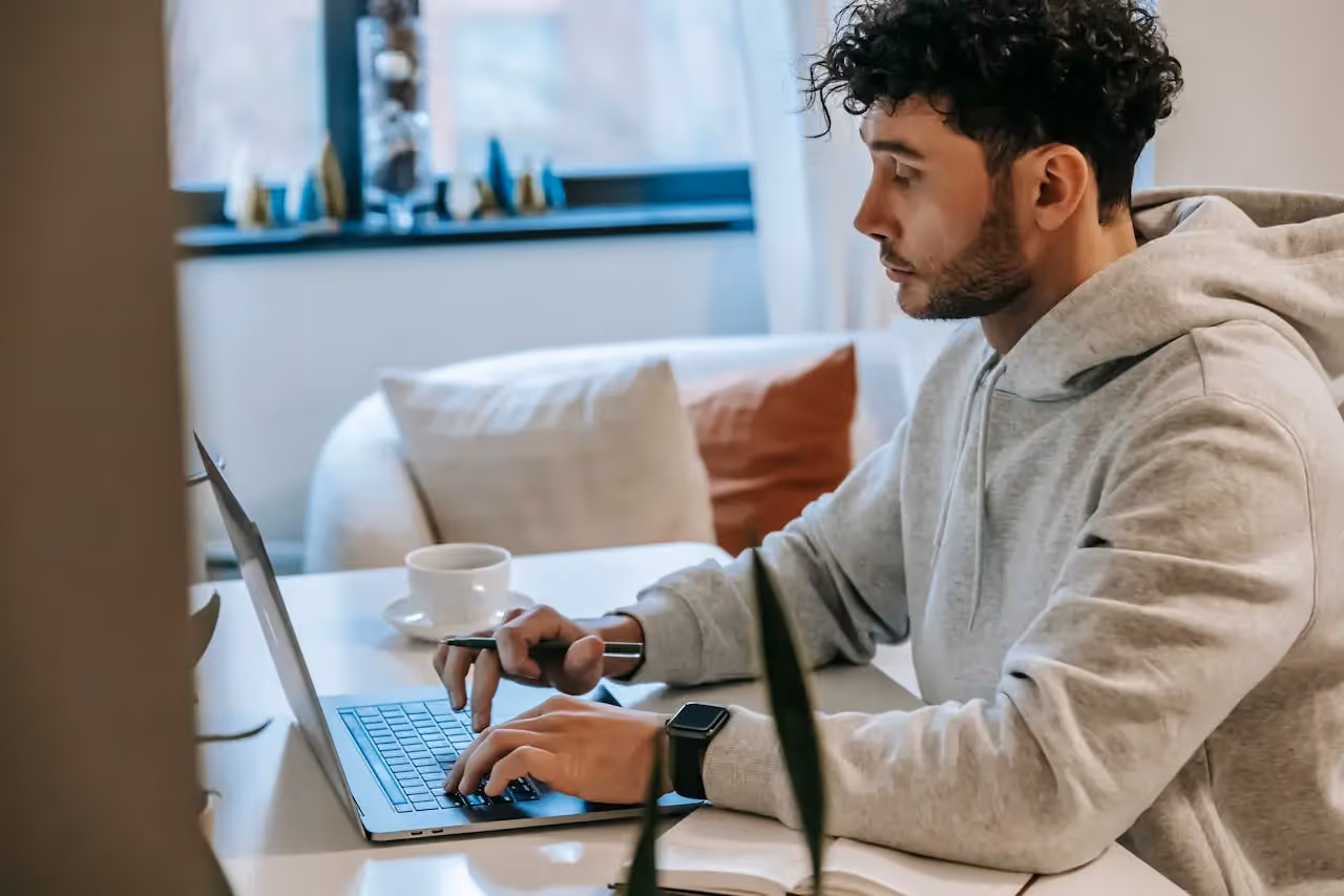 A remote worker working in his living room