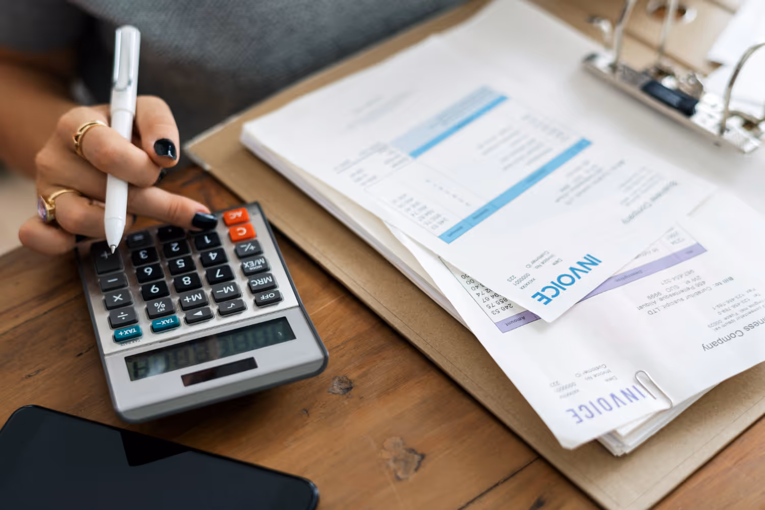 A person using a calculator