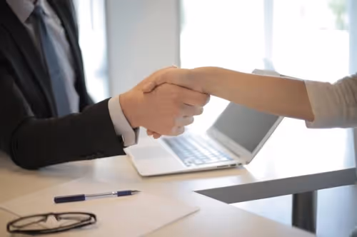 Employer and employee shaking hands