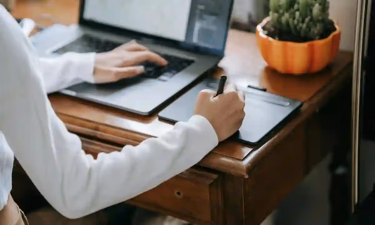 Graphic designer drawing on a tablet.