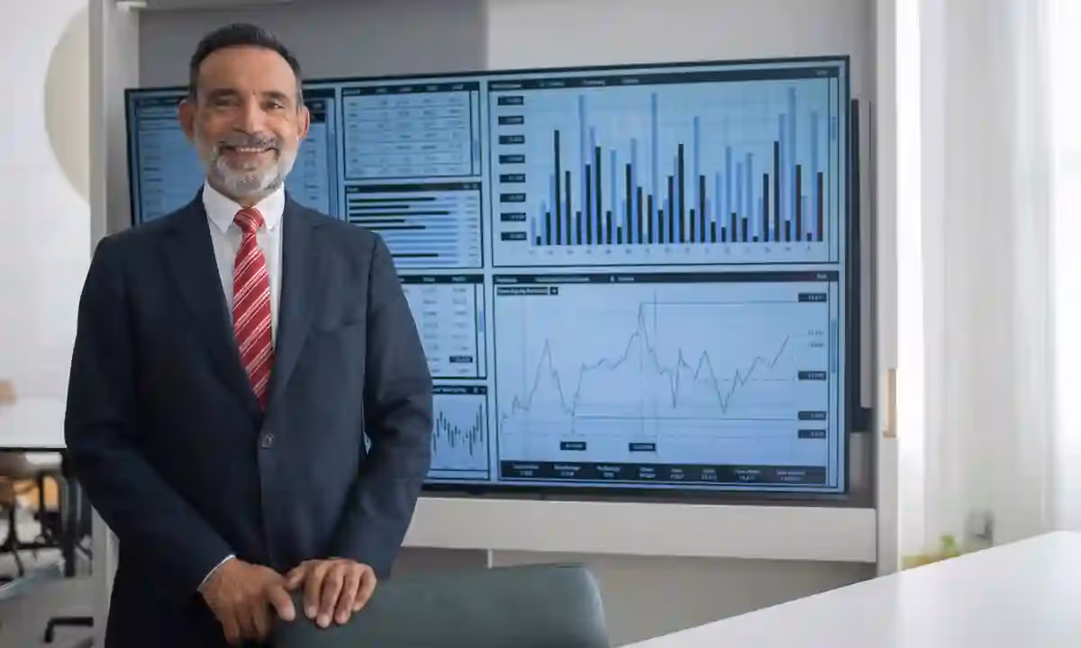 Man in front of charts.