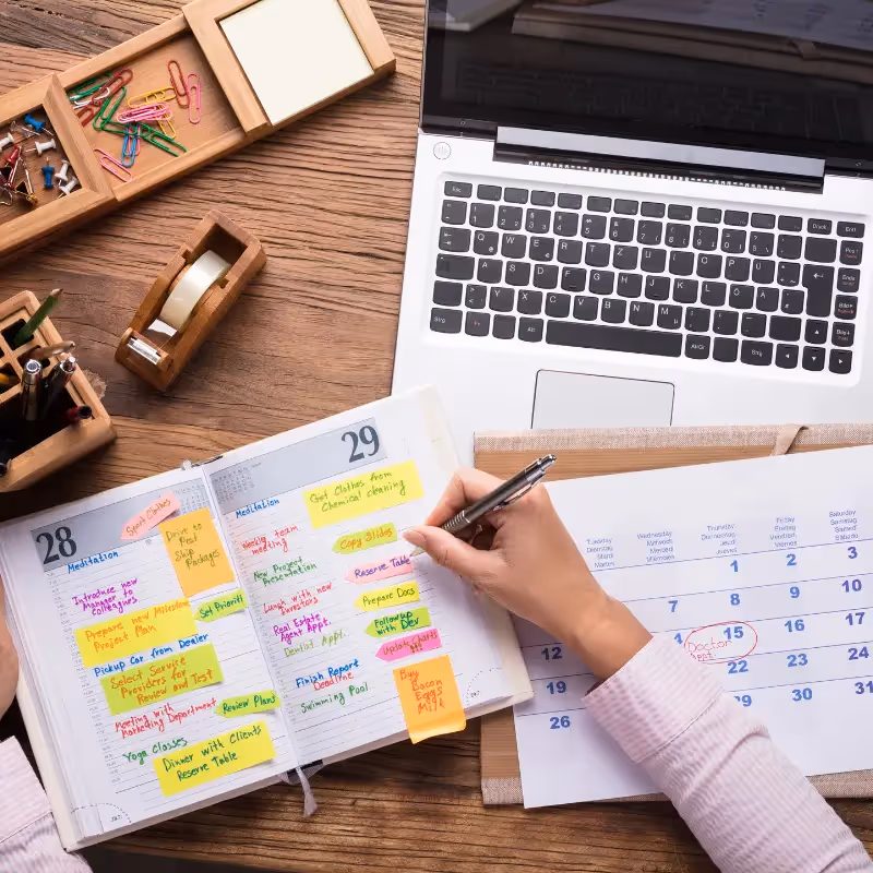 woman scheduling on her calendar