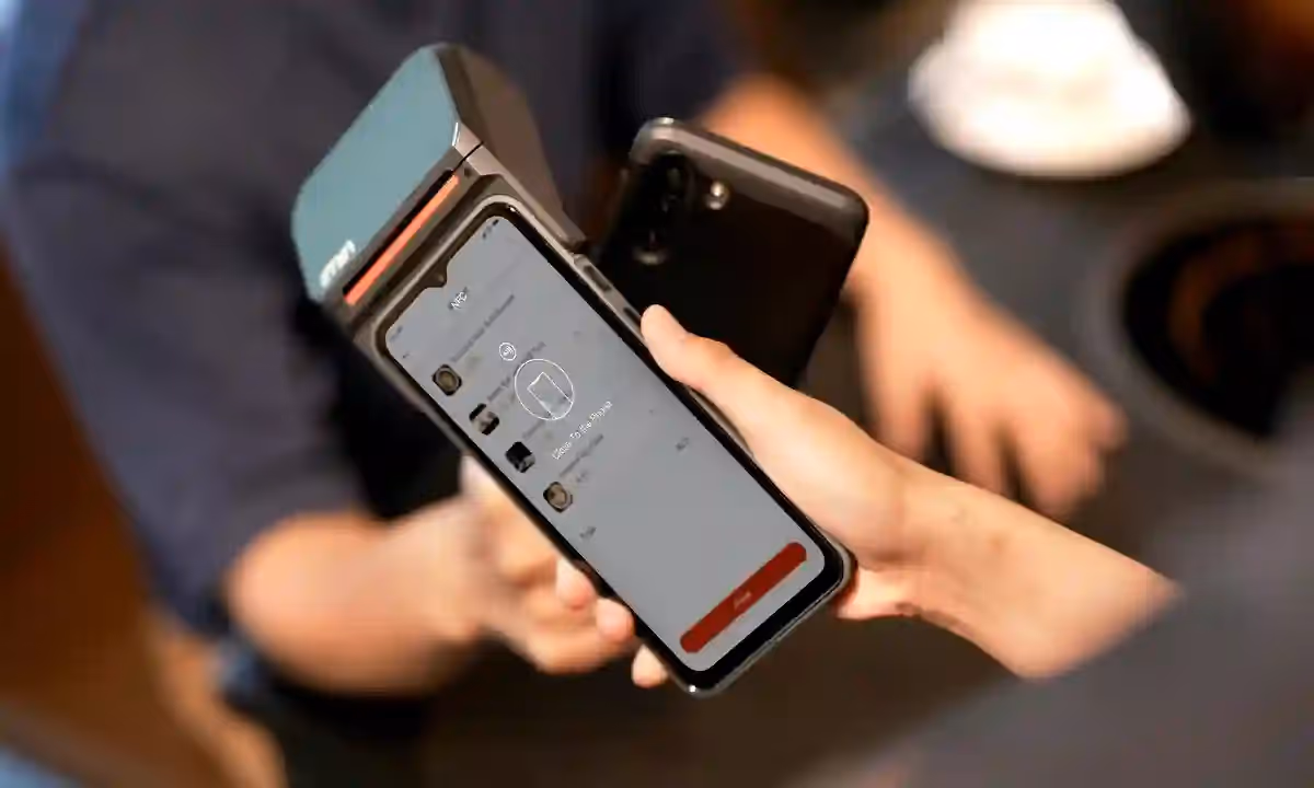 Mobile payment system by outsourced app developer