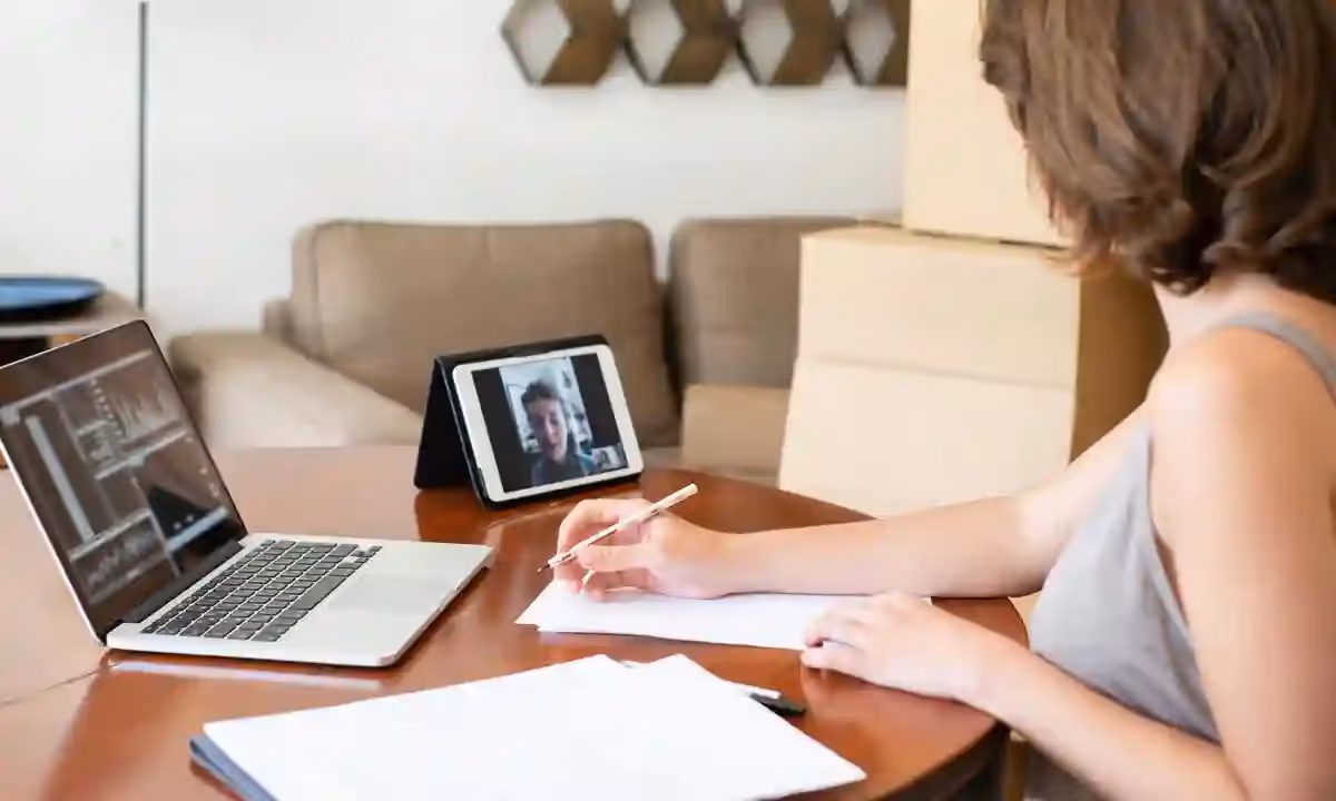 A freelance data engineer on video call with a client.