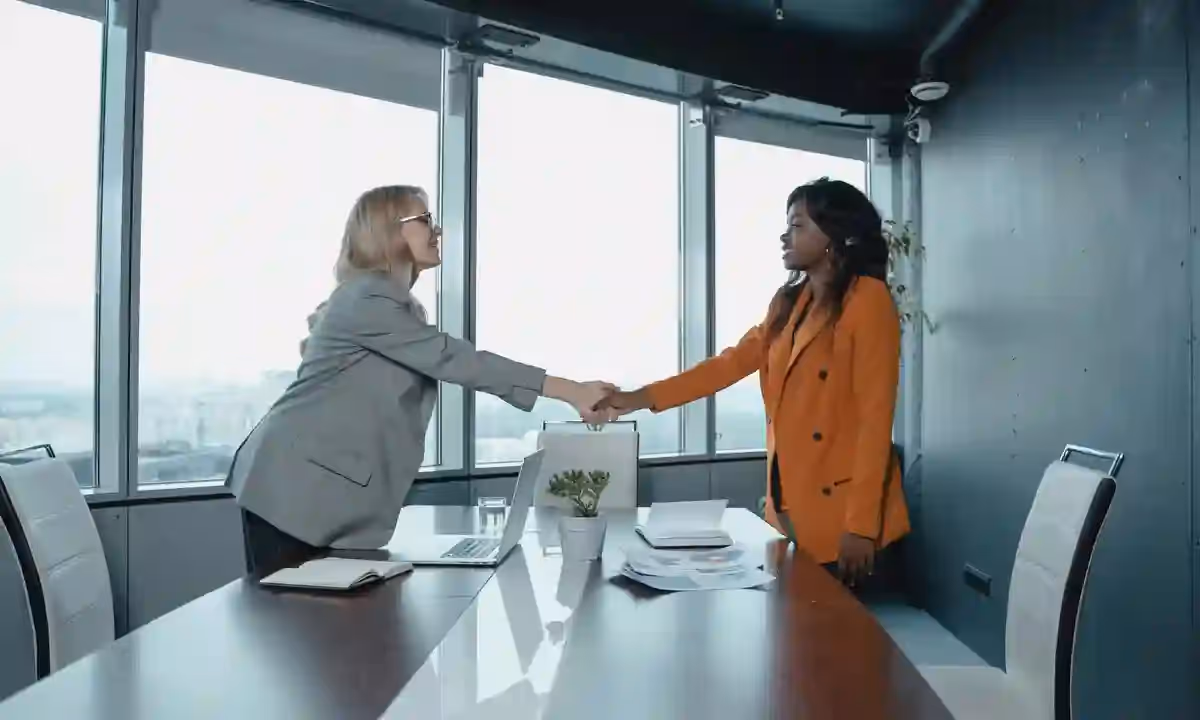 Women shaking hands.