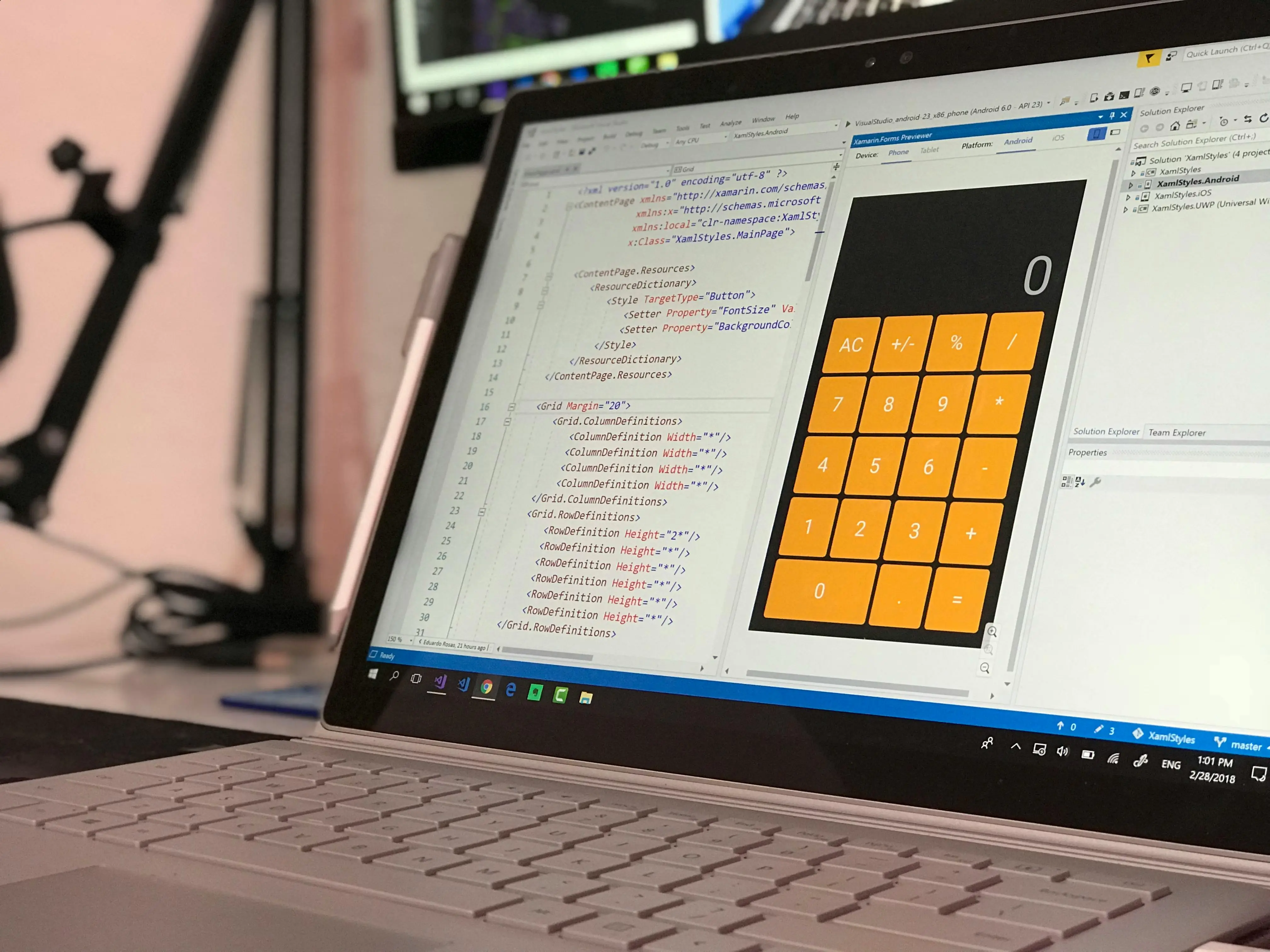 Computer screen with coding and a calculator on it.