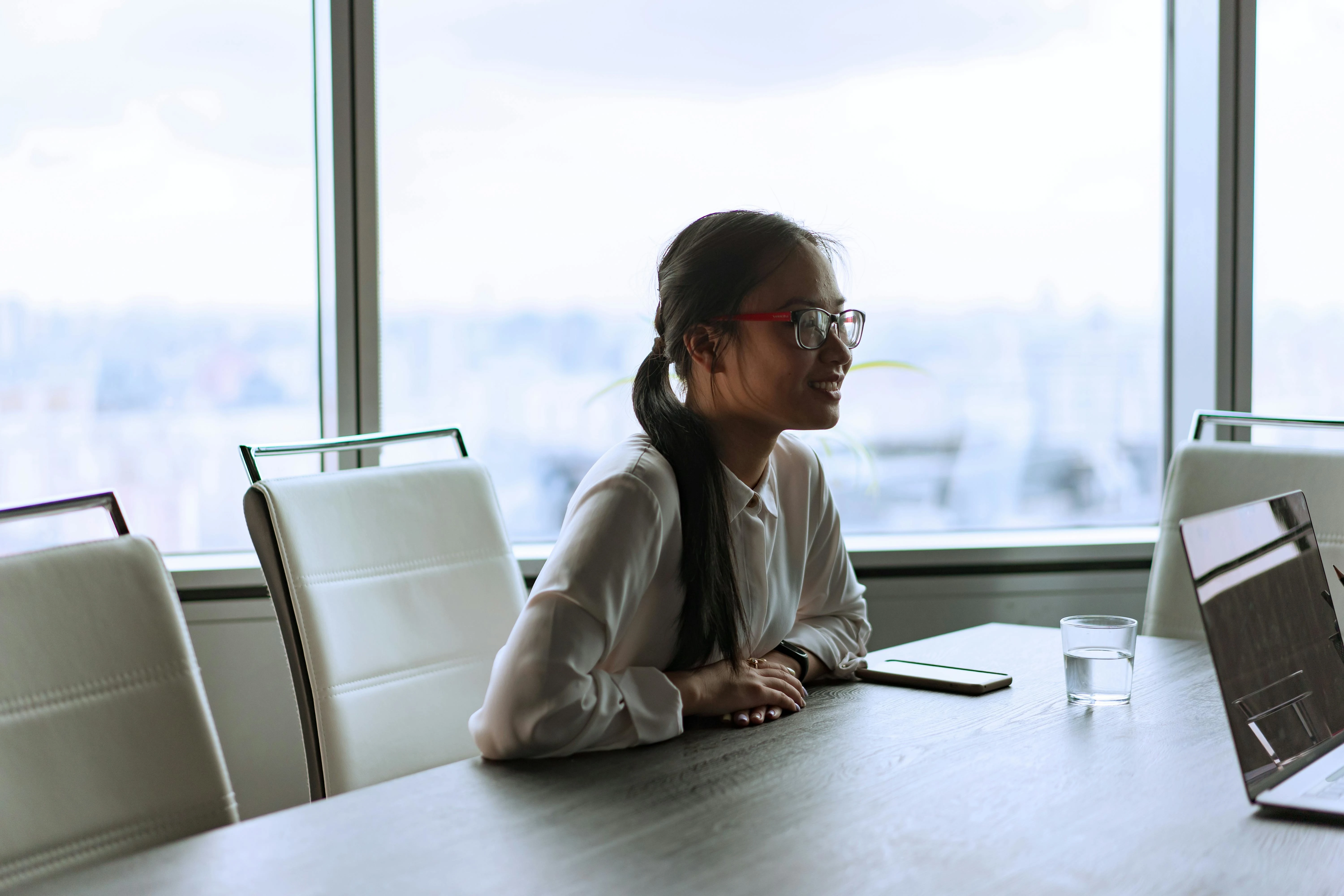 Girl sitting at an office table.