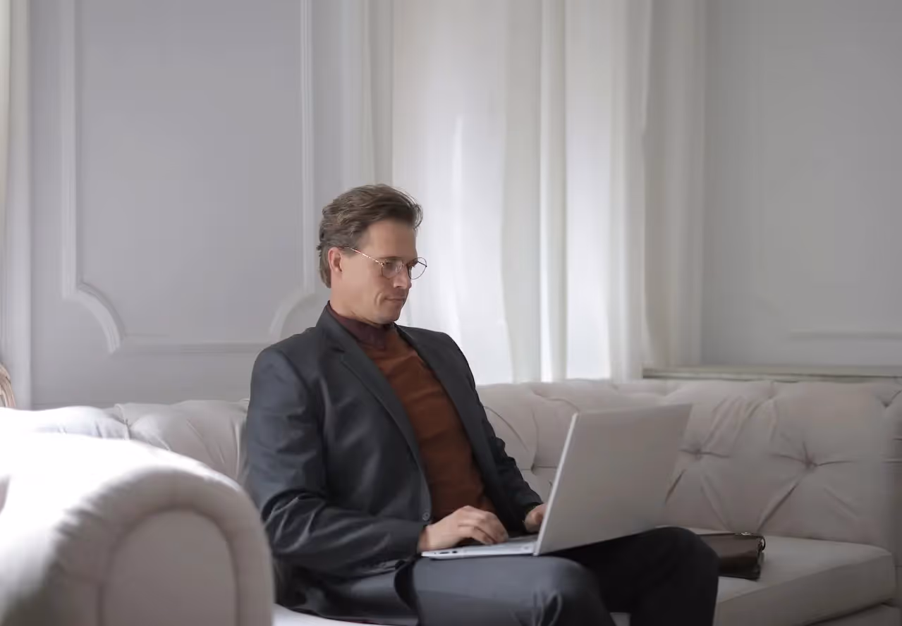 Remote employee in a business suit working at home