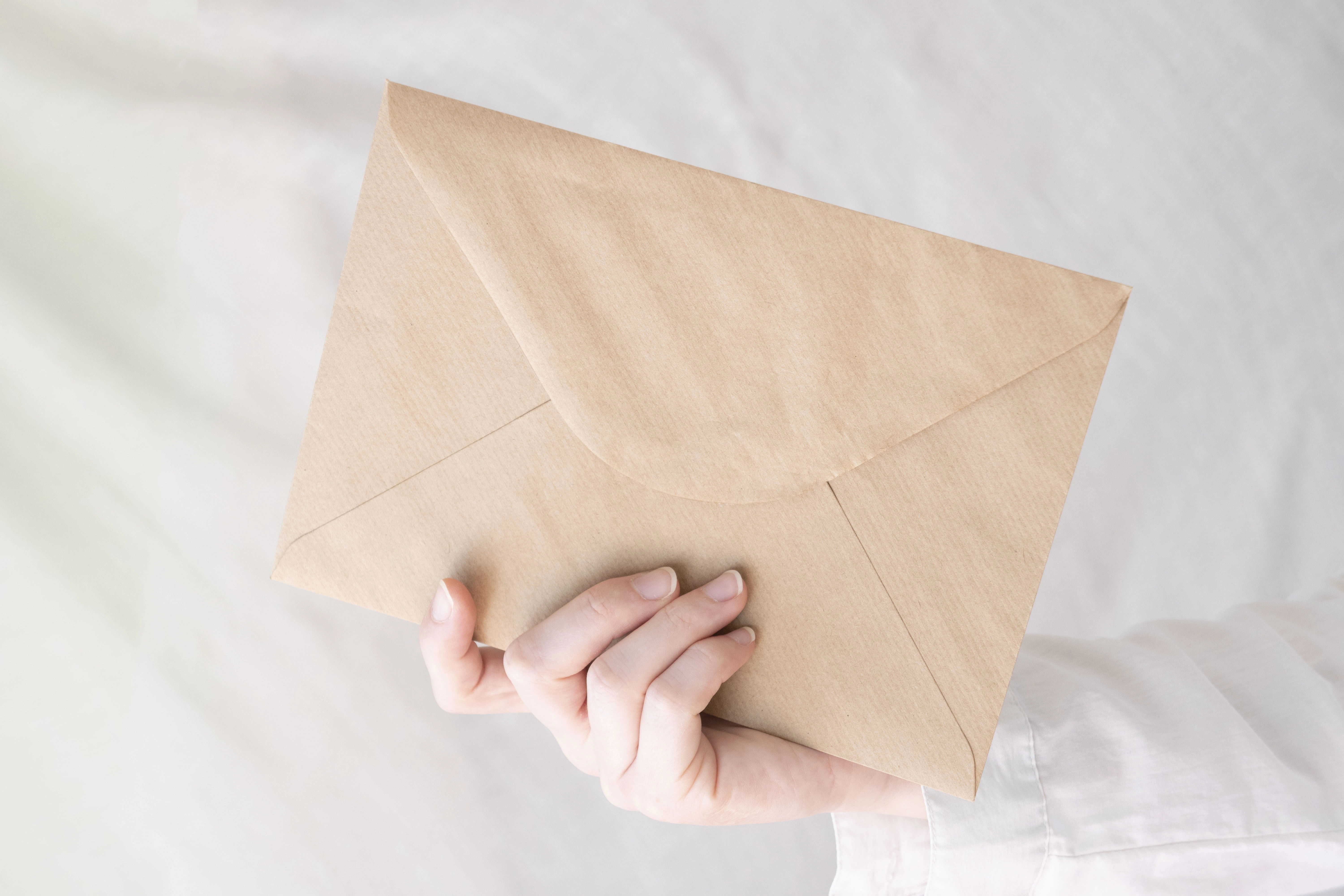 hand holding envelope
