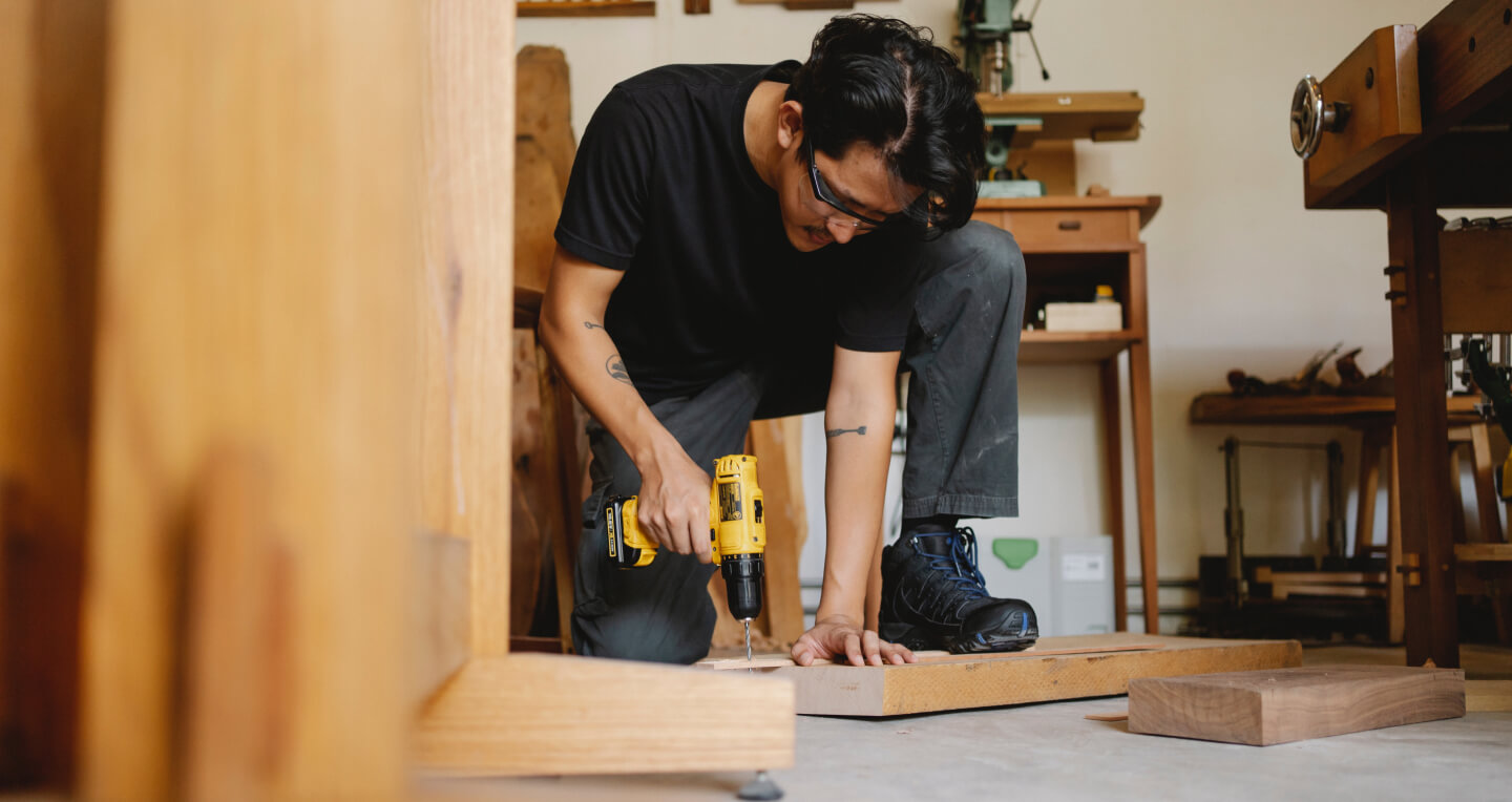 Hand-planing custom woodwork at the FVC Construction workshop