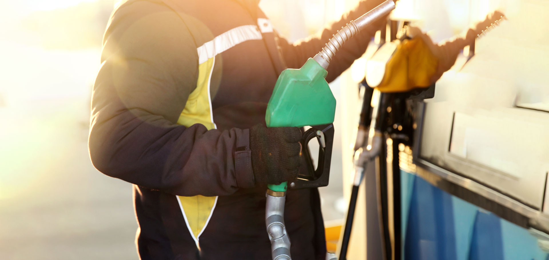 a trucker pays for gas at a station using a company fuel discount card