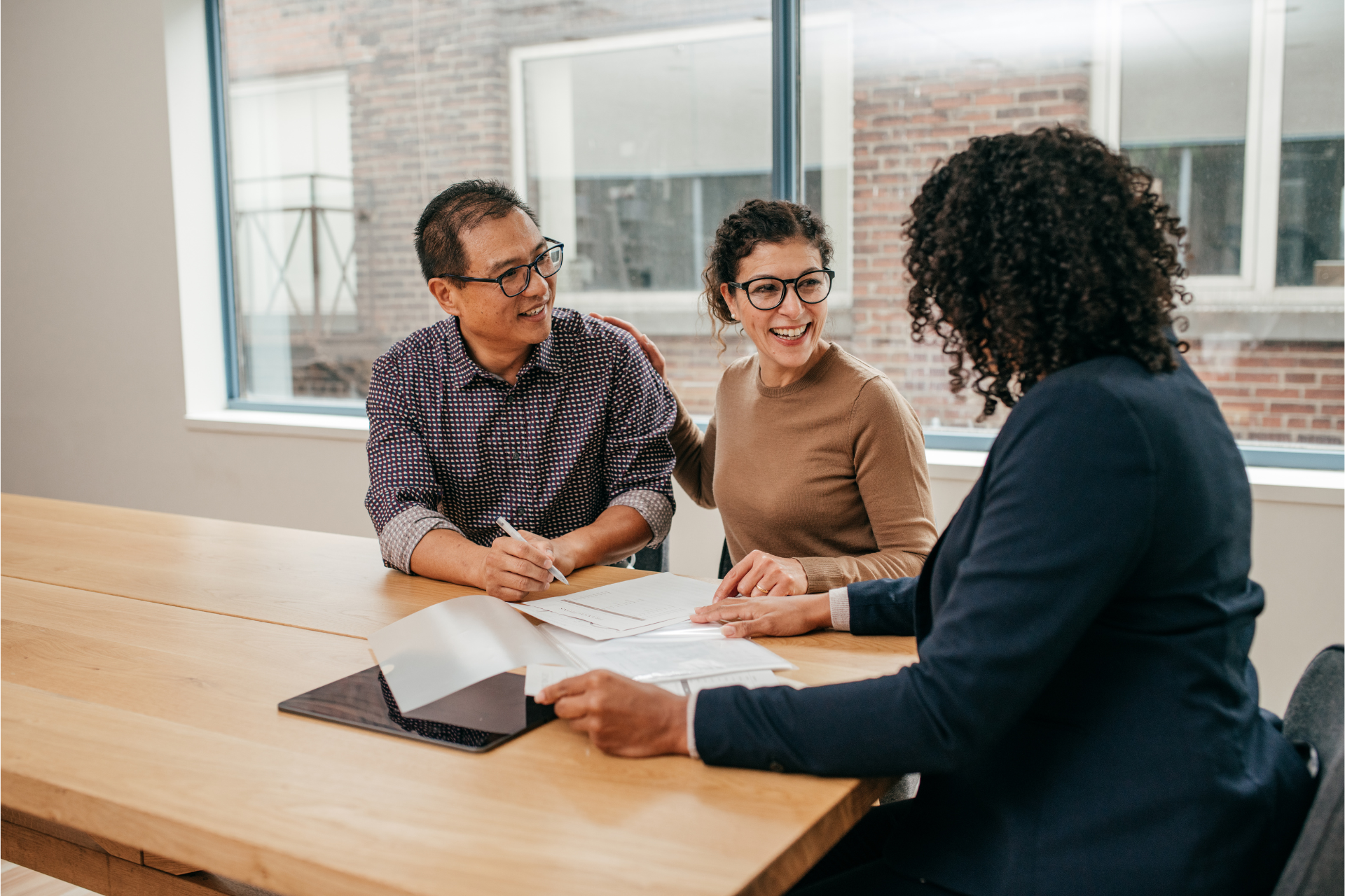 Two business owners complete the application process to receive invoice financing