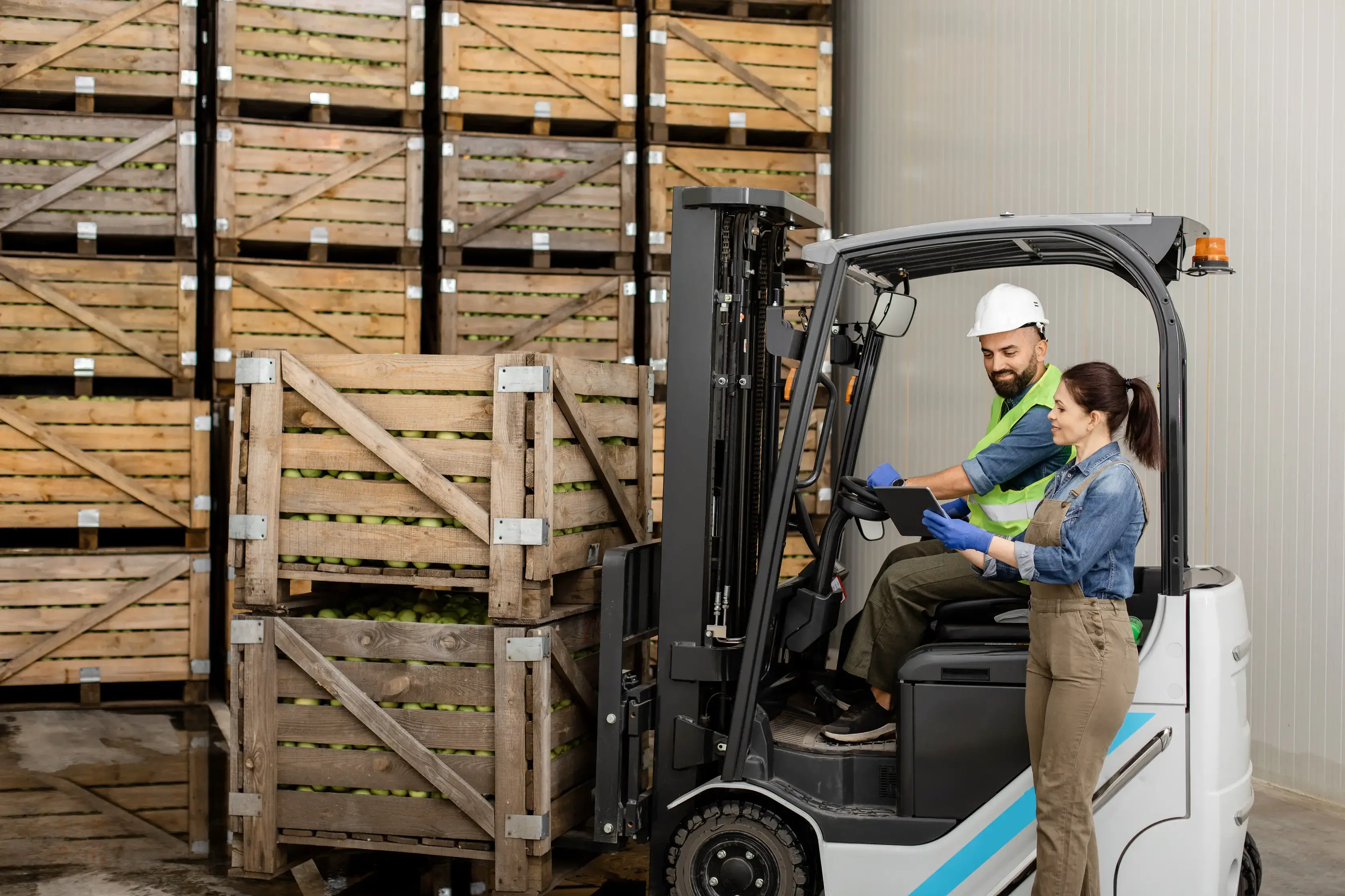 warehouse workers on a forklift