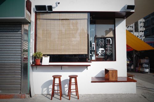 Tadaima cafe window with coffee and food illustrations