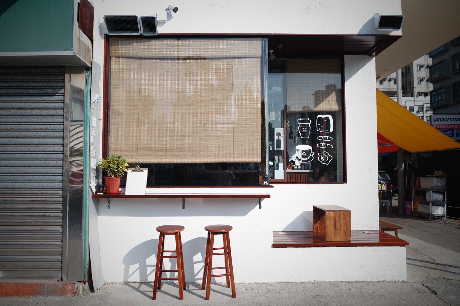 Tadaima cafe window with coffee and food illustrations