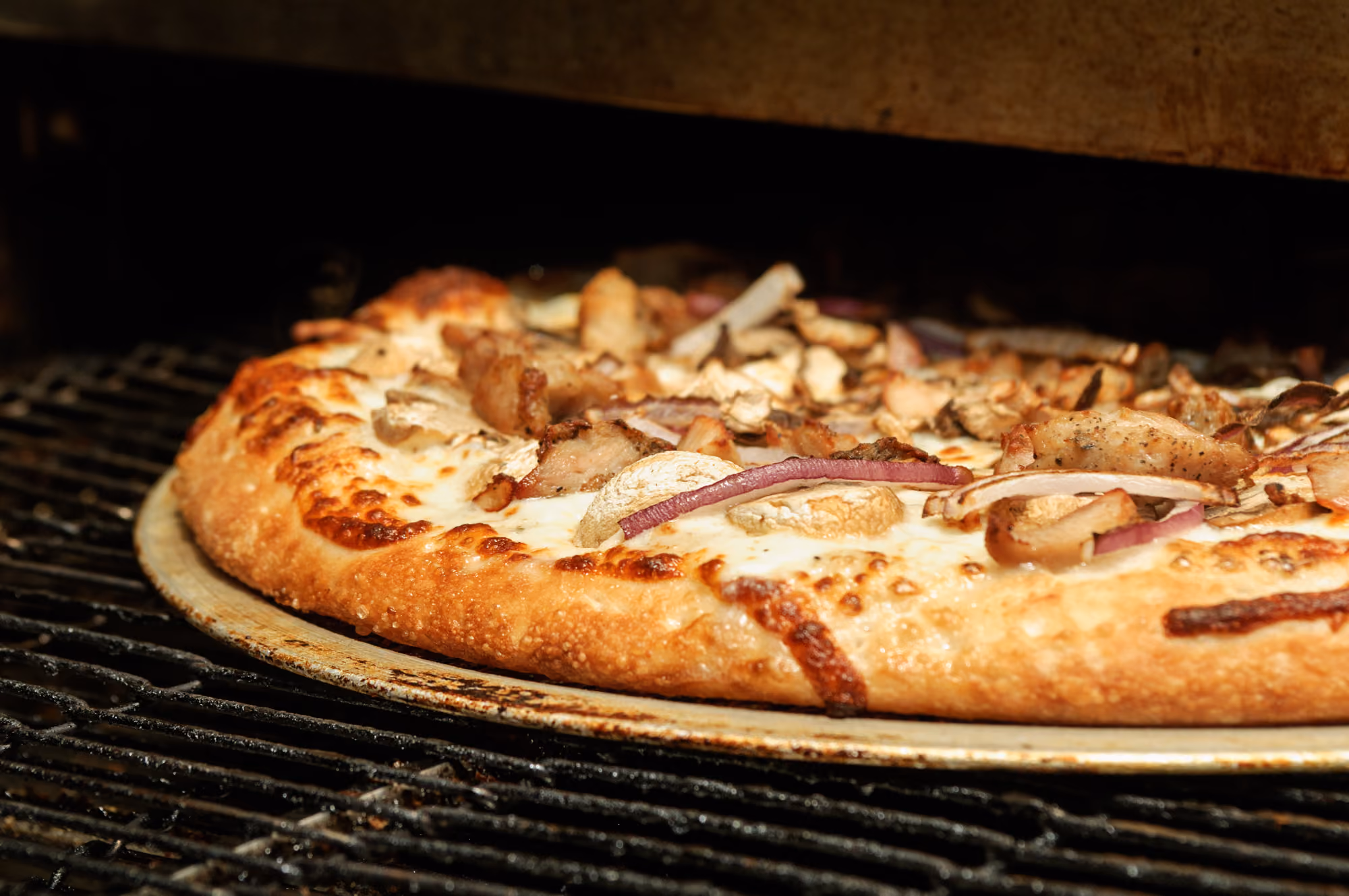 pizza baking in oven