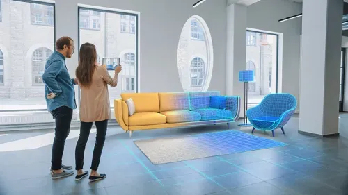 A couple view their new sofa as an augmented reality model within their real world space
