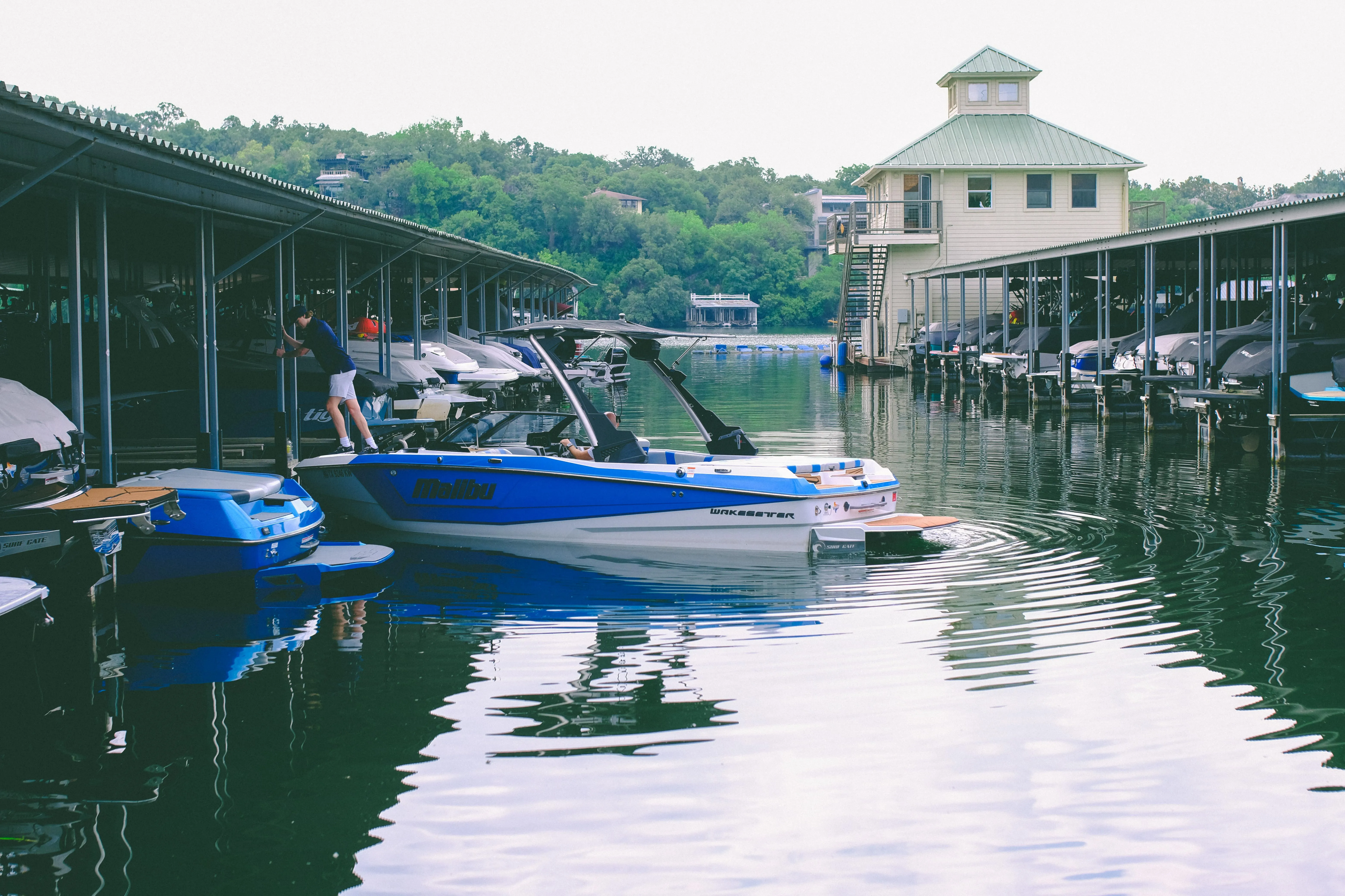 Nautical Boat Club wakeboats docked at the marina on Lake Austin