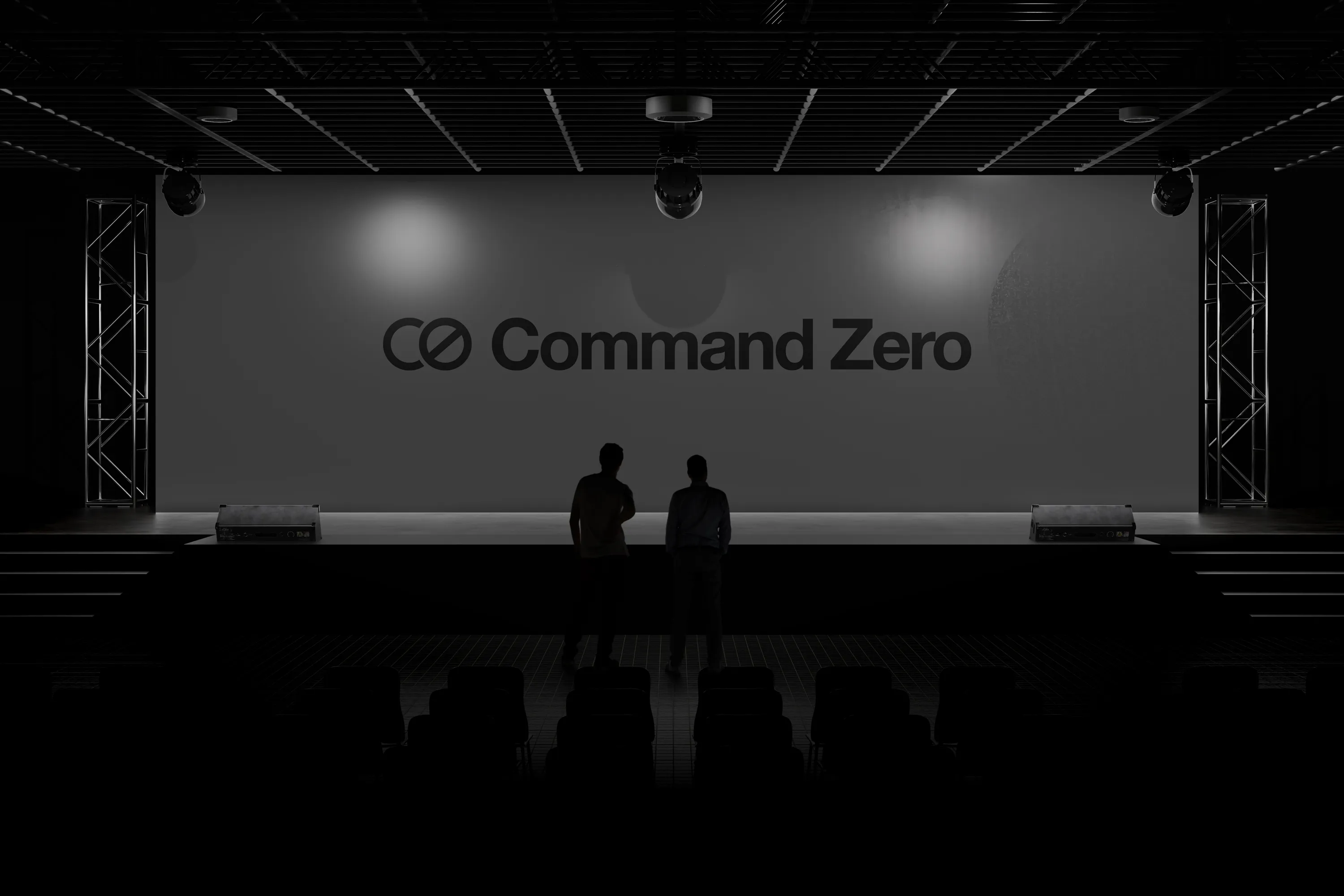 Command Zero logo on a dark keynote stage with two silhouetted speakers