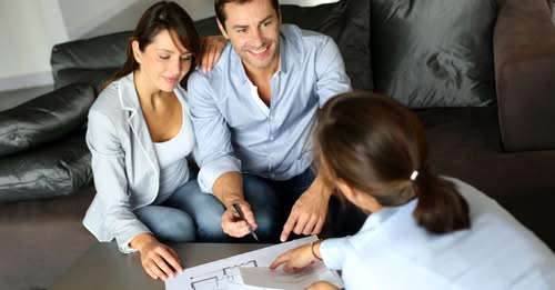 Australian homeowners reviewing a fixed-price renovation contract with their Refresh Renovations consultant