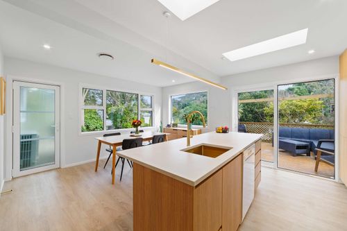 Lia in front of a kitchen