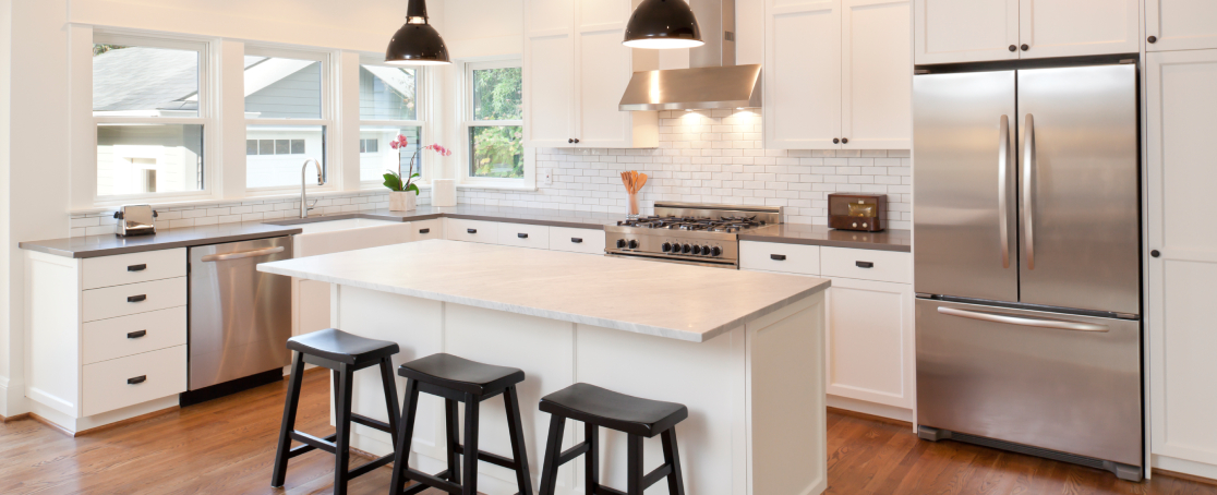 Modern kitchen renovation in a New Zealand home showing new benchtop and updated cabinetry