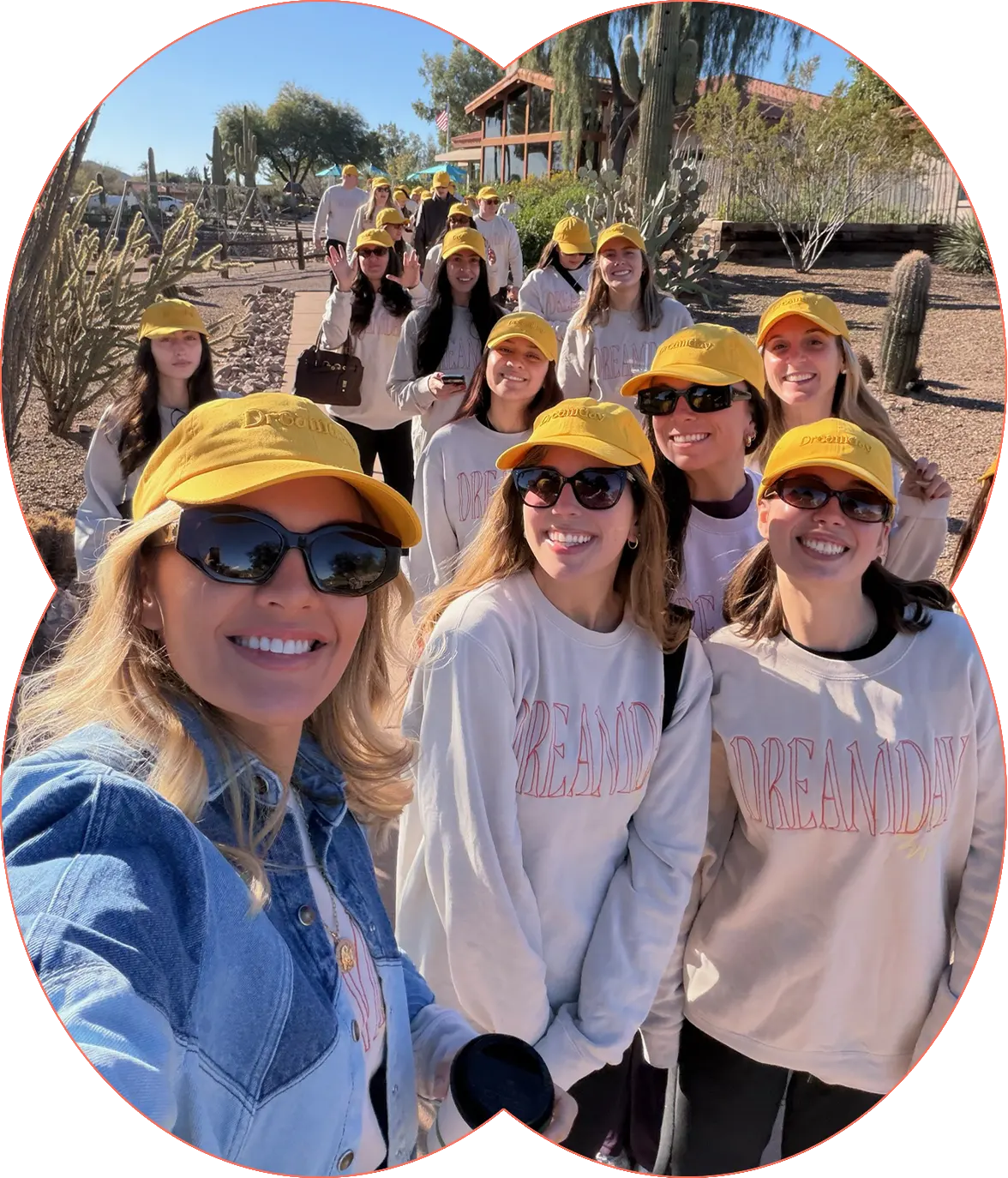 Dreamday women in yellow Dreamday caps and sweatshirts outdoors in a desert landscape.