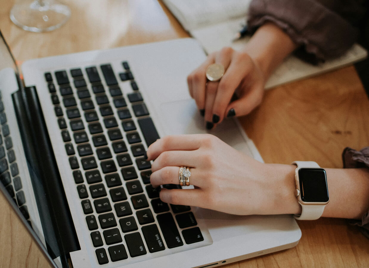 Photo of a Person using a Laptop