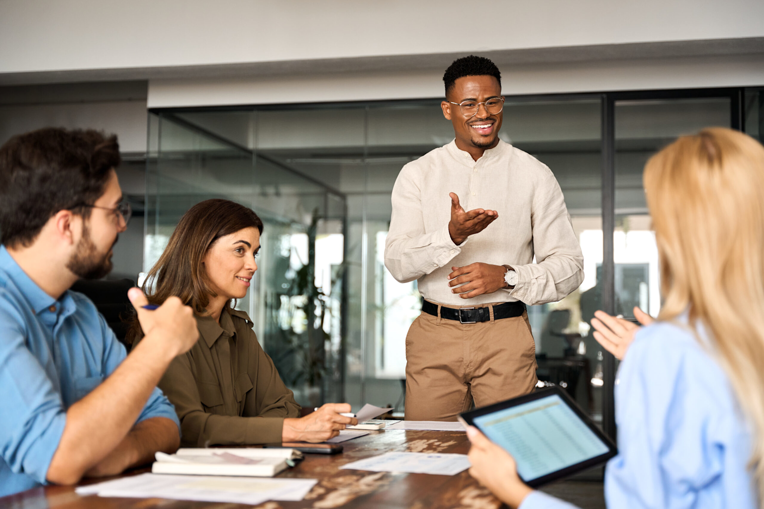 Tech professionals collaborating in a modern office meeting, representing consulting and teamwork opportunities