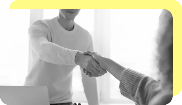 A banker shakes hands with a new client.