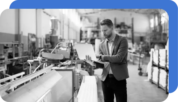 A professional uses a laptop to automatically manage risk.