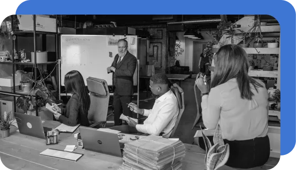 A risk management team at a bank asses current market conditions and fraud trends.