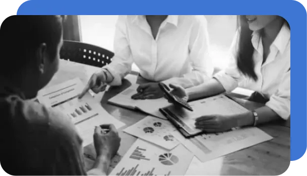 A team of people reviews documents and attempts to digitize them without document processing software.