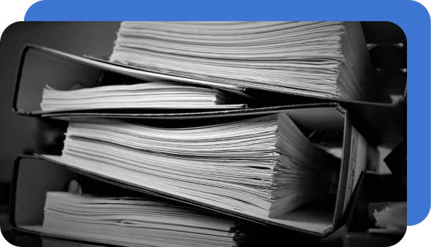 A stack of documents that could be easily computerized with intelligent document processing.