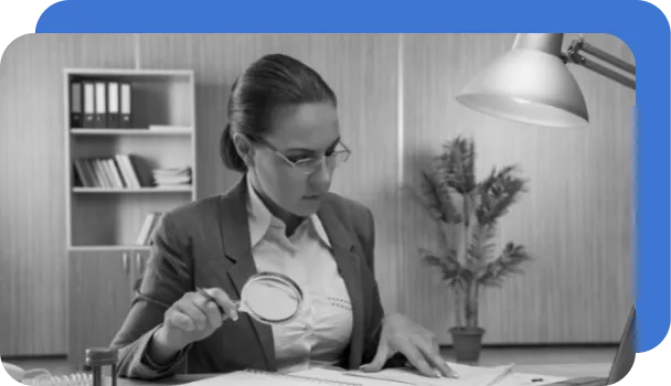 A women tries to detect fraud manually without the help of AI.