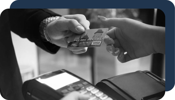 A person uses a credit card to potentially pay for a fraudulent purchase.