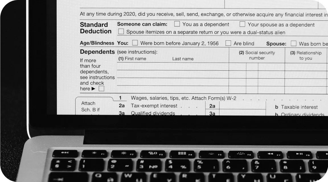 Partially visible IRS Form 1099 displayed on a laptop screen, representing electronic tax form review and the importance of verifying digital document authenticity.