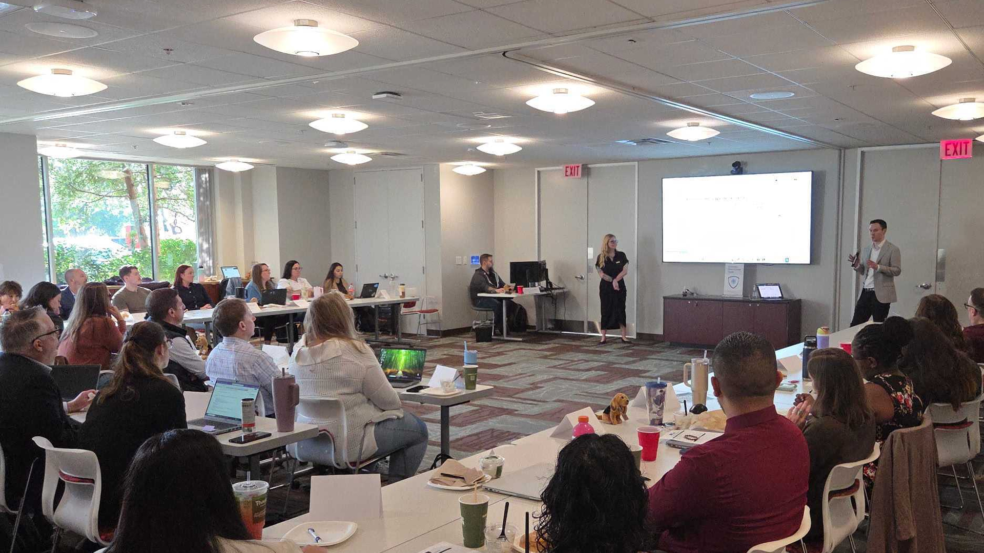 Fraud and risk professionals attending an in-person Fraud Round Table focused on sharing fraud detection strategies