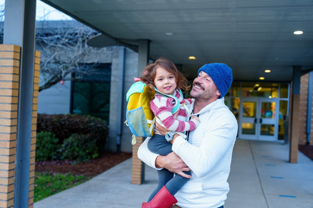 Parent and child outside an early learning centre