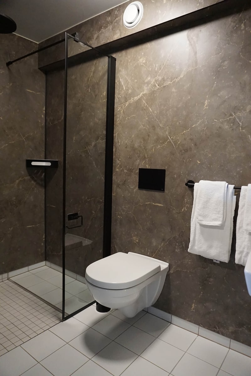 Toilet and sink in the bathroom.