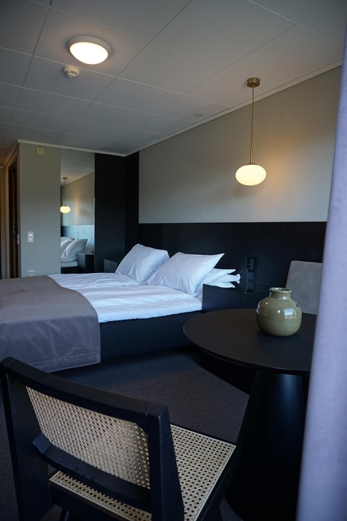 Chairs and beds in hotel rooms.