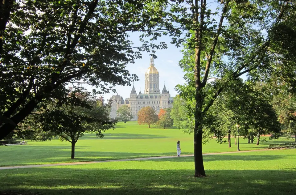 Bushnell Park in Hartford, with the Connecticut State Capitol beyond the trees